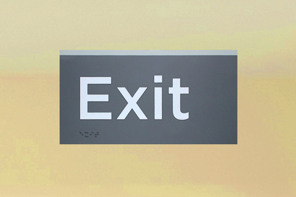 Braille exit sign